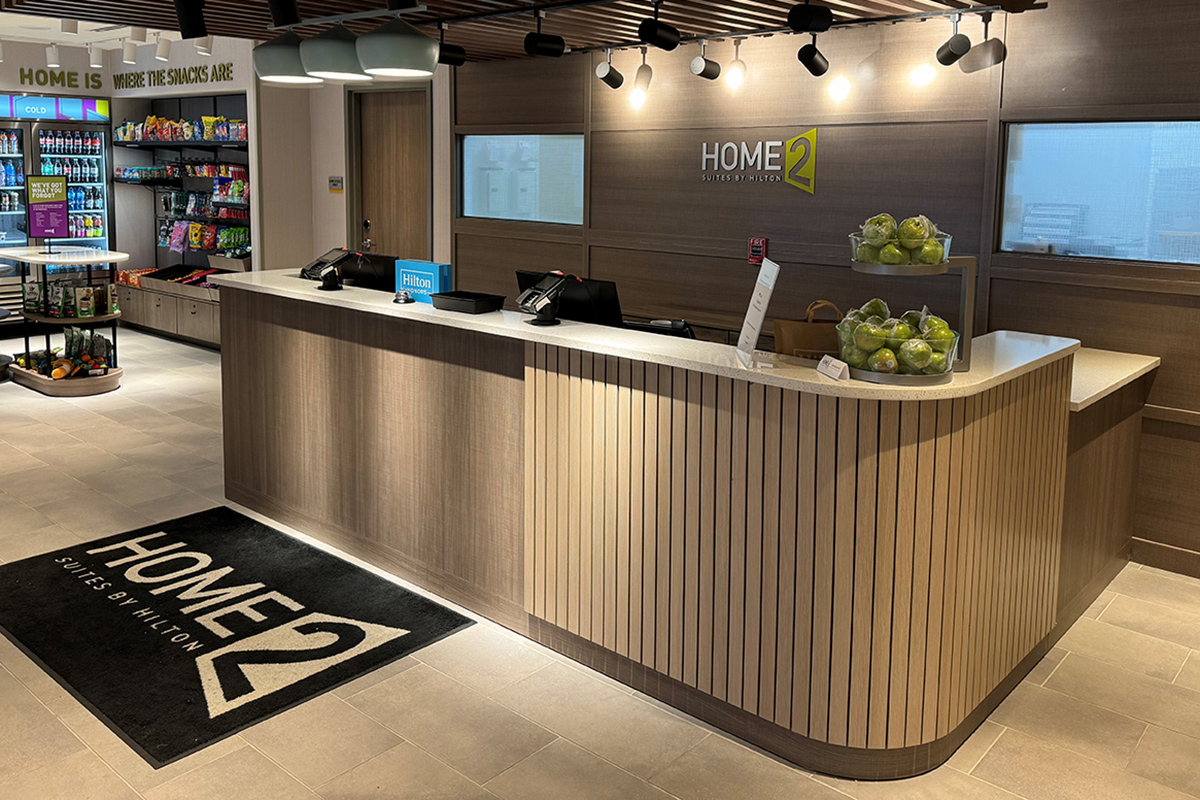 hotel custom lobby reception desk and television wall